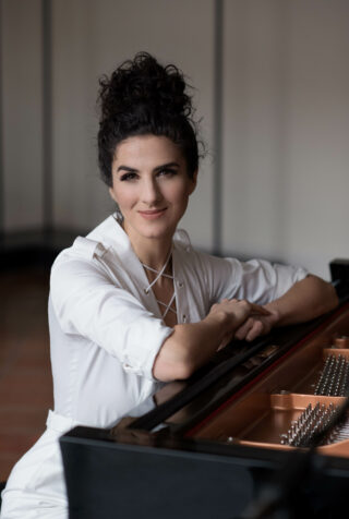 Laila white outfit at piano – Rachel Cicoria